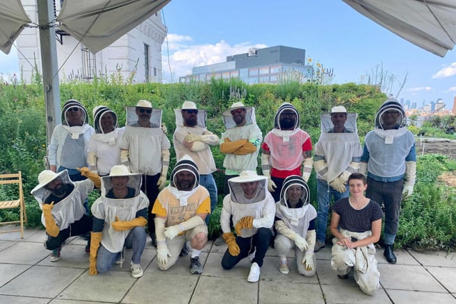 strongDM team in New York with honey bees